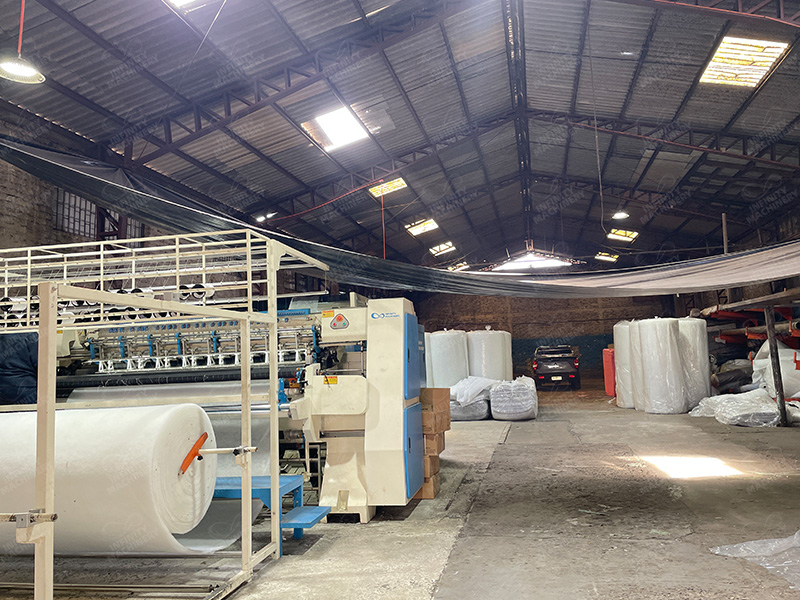 Customer's factory overview showing modern mattress production facility