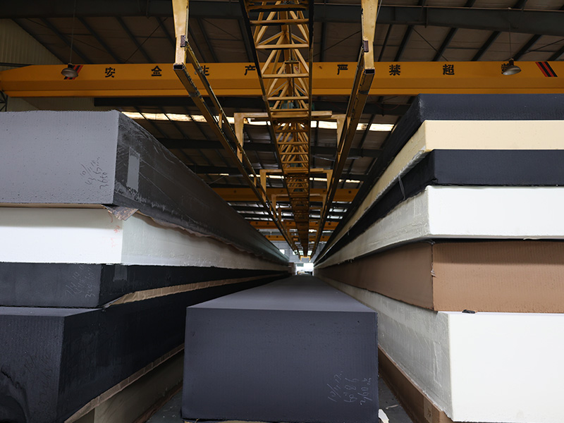High-quality finished foam blocks in warehouse with overhead crane system