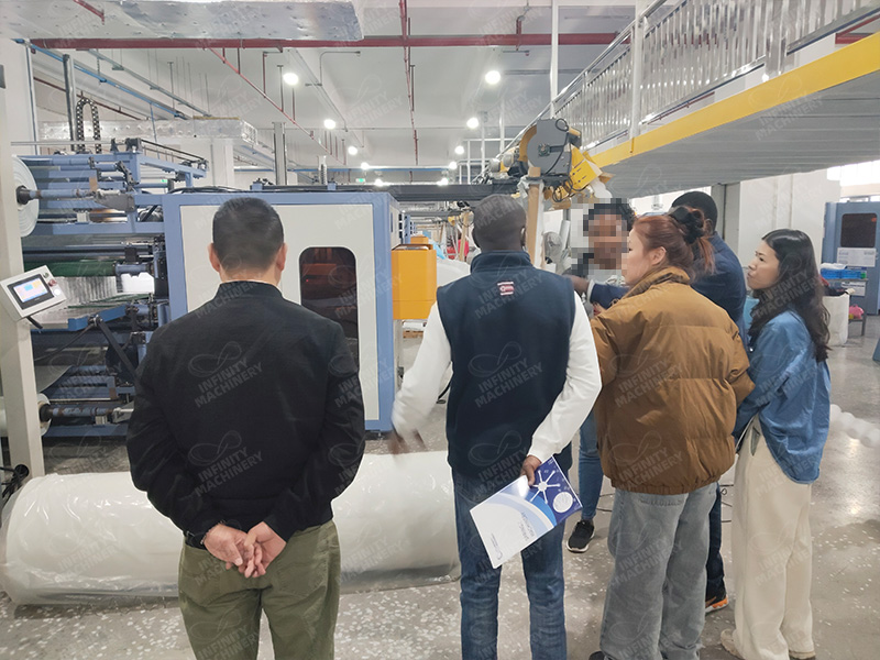 Taking clients on a tour of the pocket spring machine factory