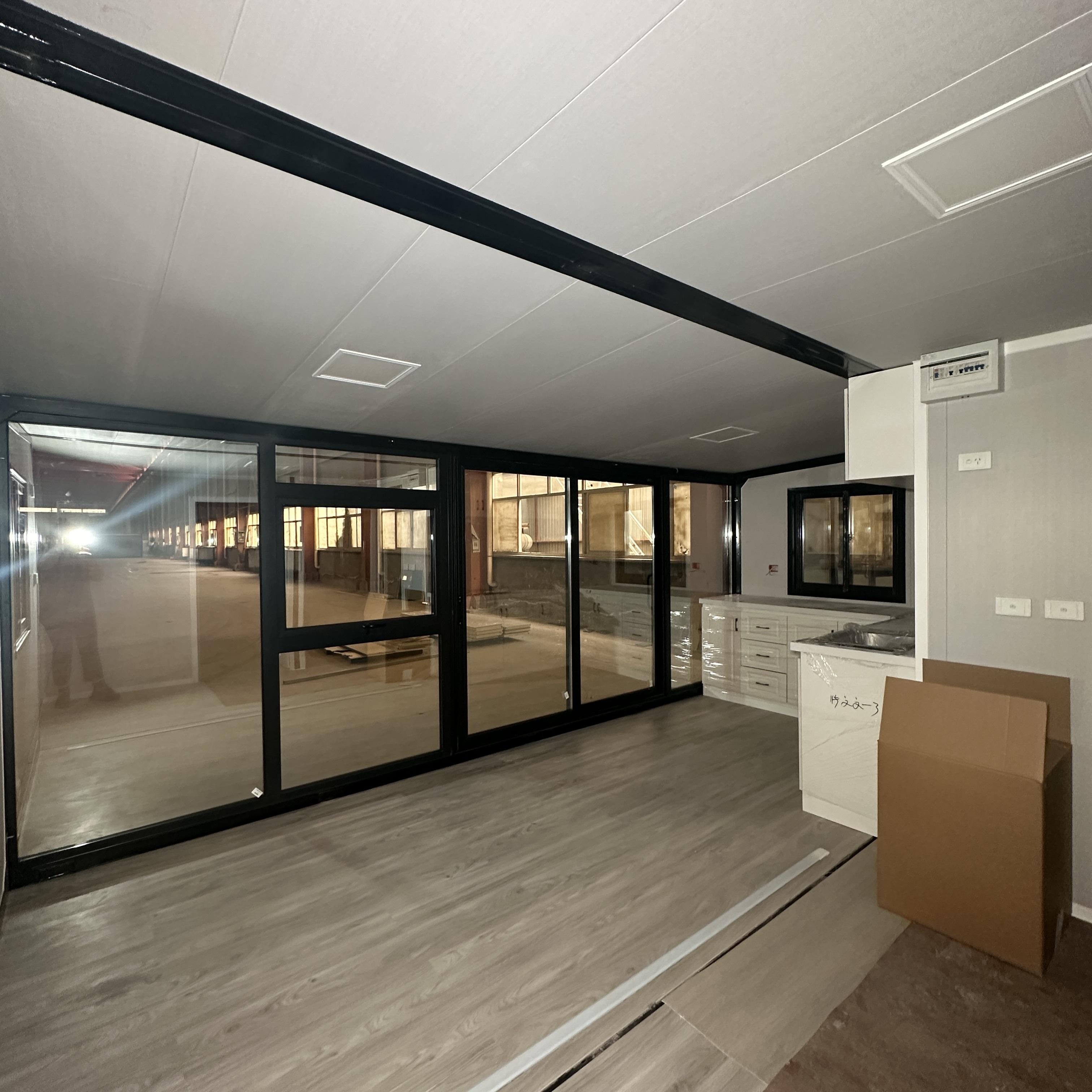 Container House with One Side Glass