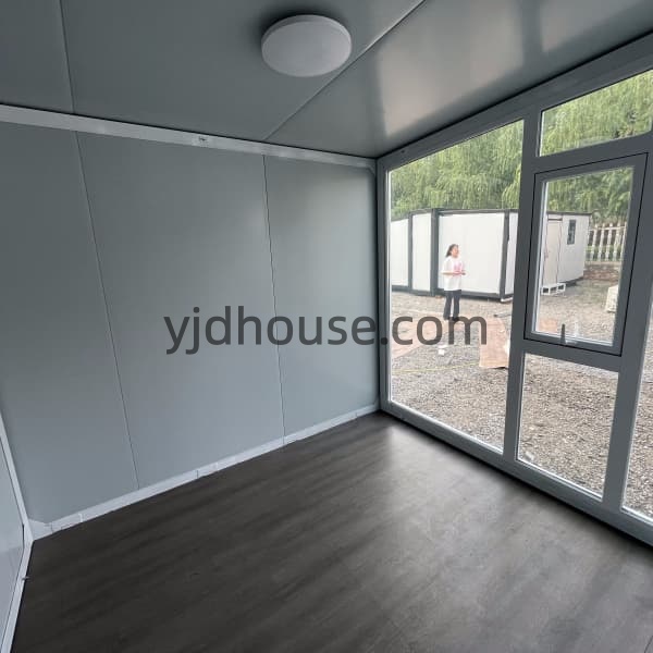 Interior of expandable container house with large panoramic window