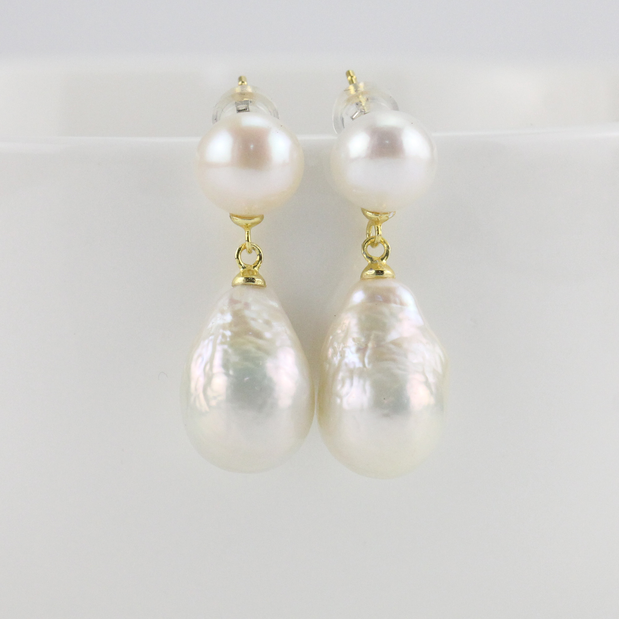 small and big pearl earrings