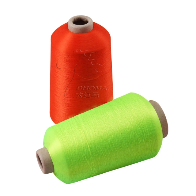 Dyed recycled polyester yarn cones produced in-house at DHOMA