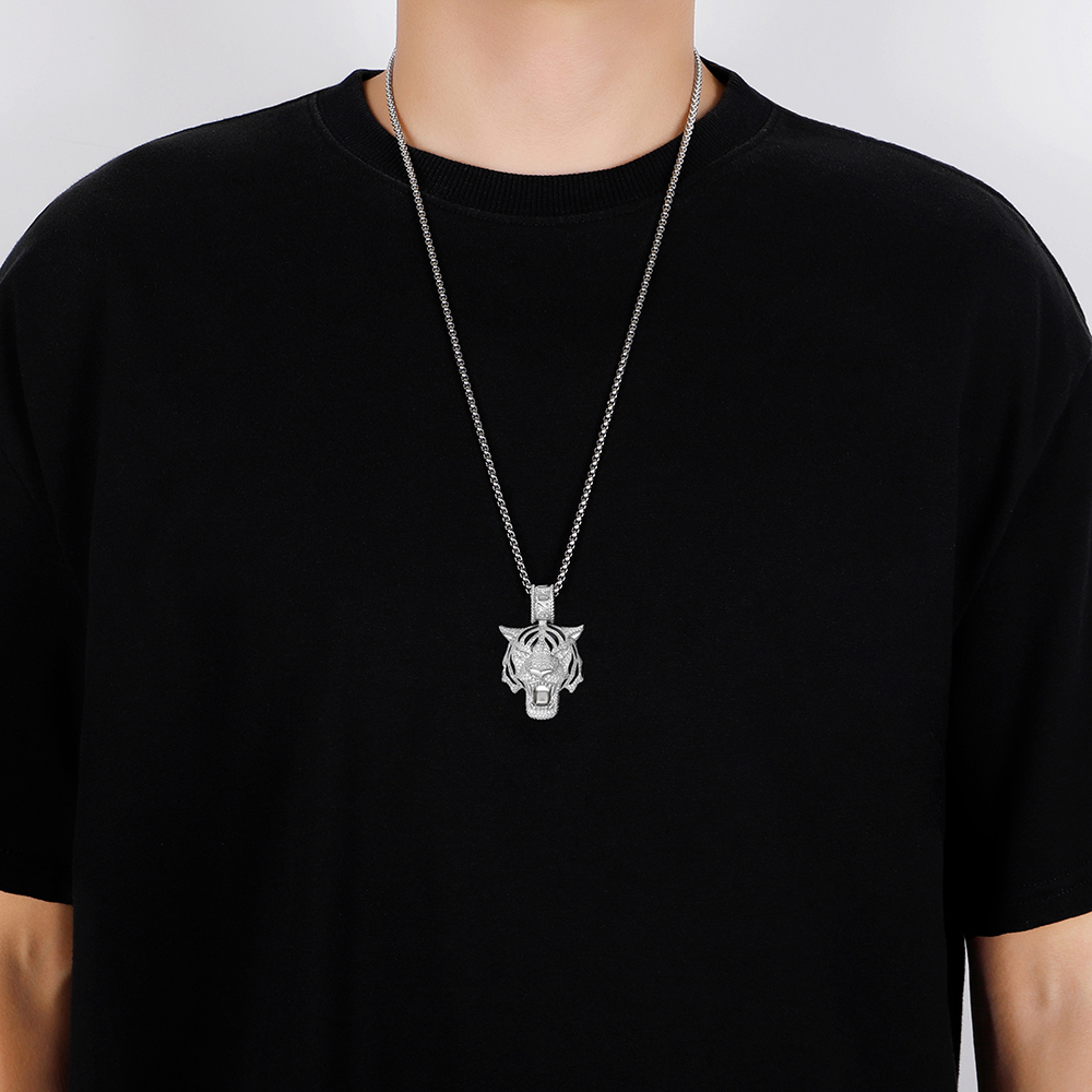 Man wearing streetwear silver tiger necklace with hoodie.