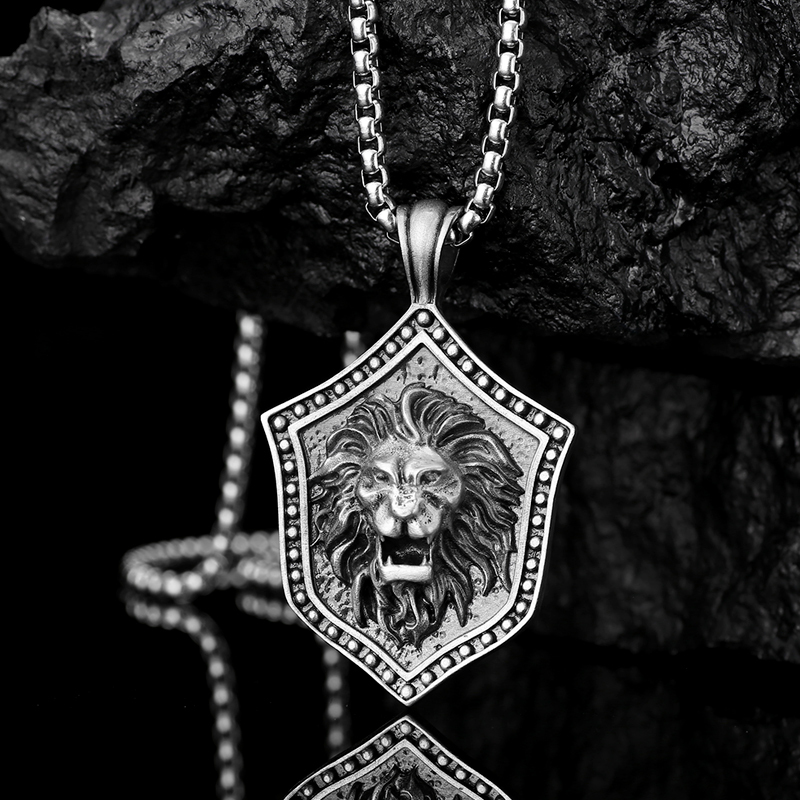 Solid lead-free pewter pendant featuring a 3D relief of a roaring lion head mounted on a medieval studded shield