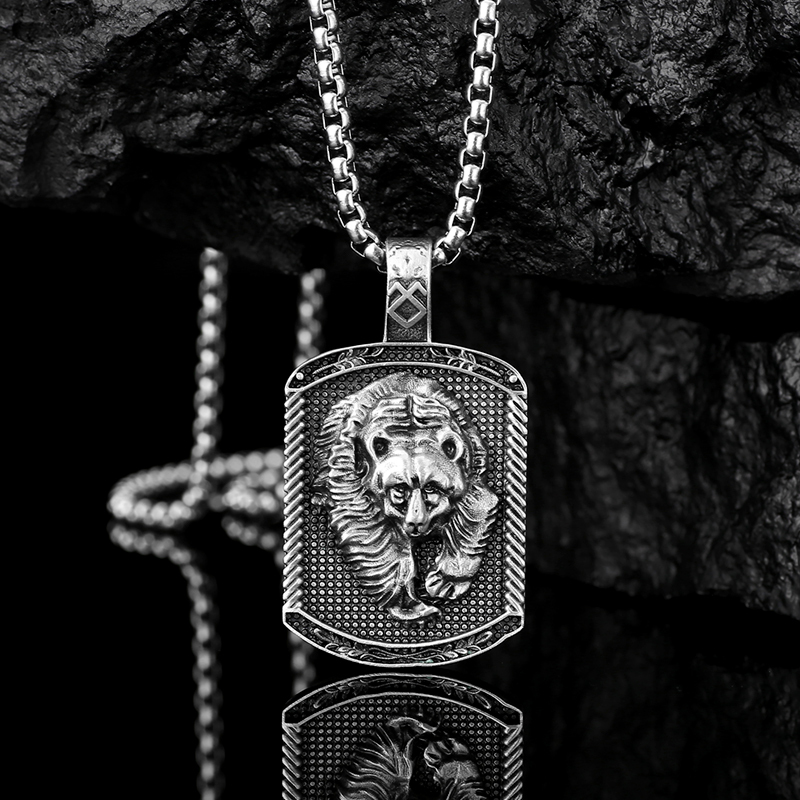 Rugged solid lead-free pewter dog tag pendant featuring a 3D relief of a charging grizzly bear with a runic symbol on the bail