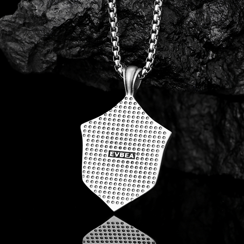 Solid lead-free pewter pendant featuring a 3D relief of a roaring lion head mounted on a medieval studded shield