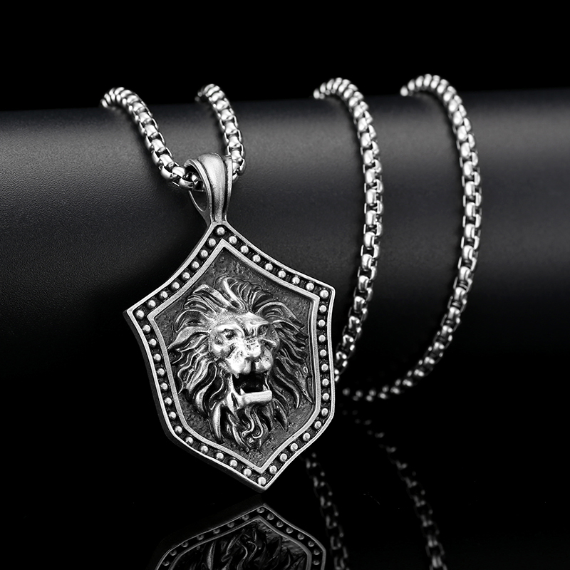Solid lead-free pewter pendant featuring a 3D relief of a roaring lion head mounted on a medieval studded shield
