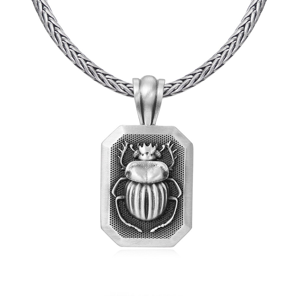 Solid lead-free pewter pendant featuring a 3D relief of an ancient Egyptian Scarab beetle set inside a rectangular frame with a textured background