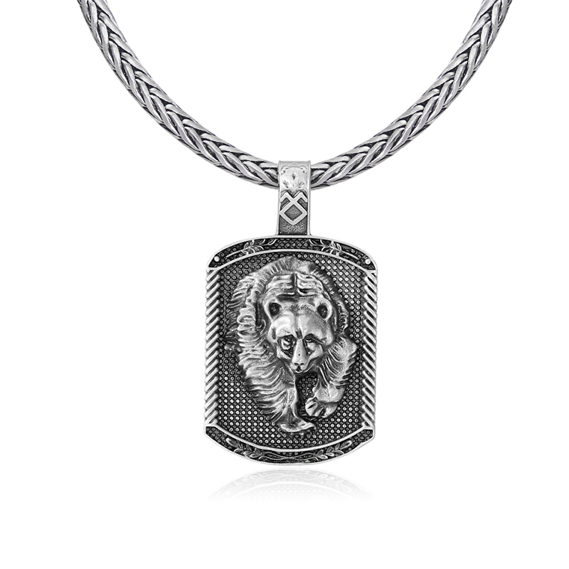 Rugged solid lead-free pewter dog tag pendant featuring a 3D relief of a charging grizzly bear with a runic symbol on the bail