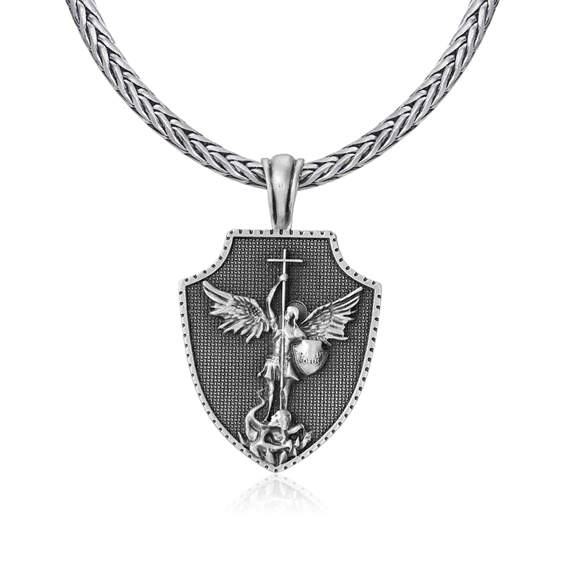 Solid lead-free pewter shield pendant featuring a 3D relief of St. Michael the Archangel defeating a dragon with a cross spear