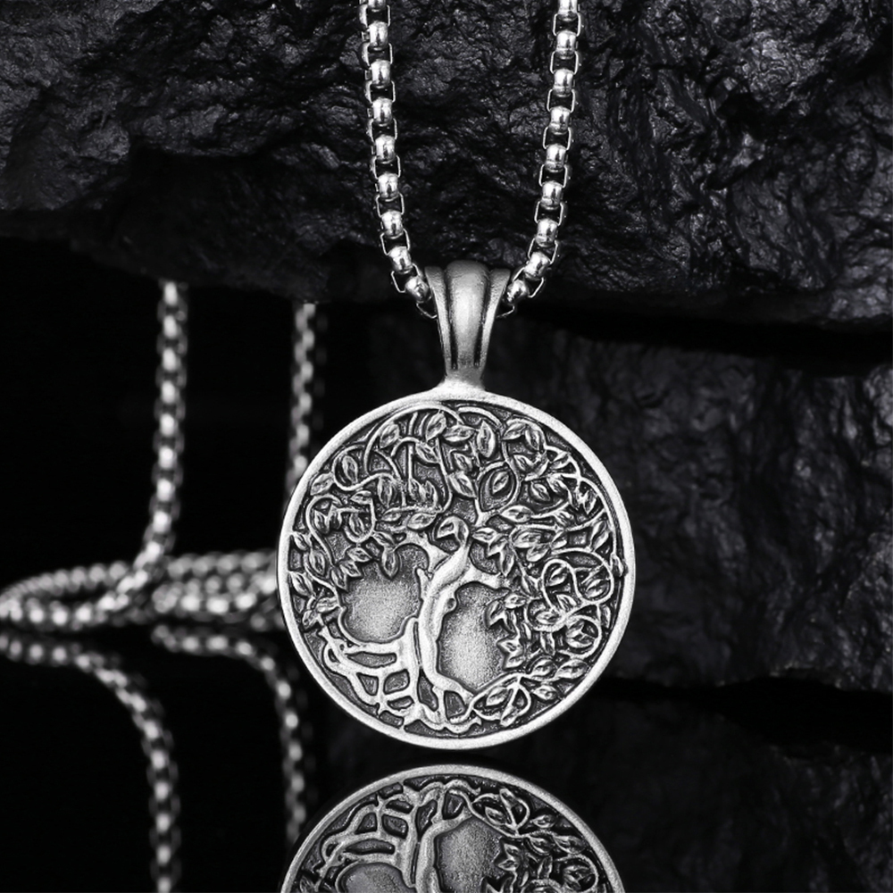 Solid lead-free pewter pendant featuring a highly detailed 3D relief of a Tree of Life with lush leaves and deep roots on a solid circular background