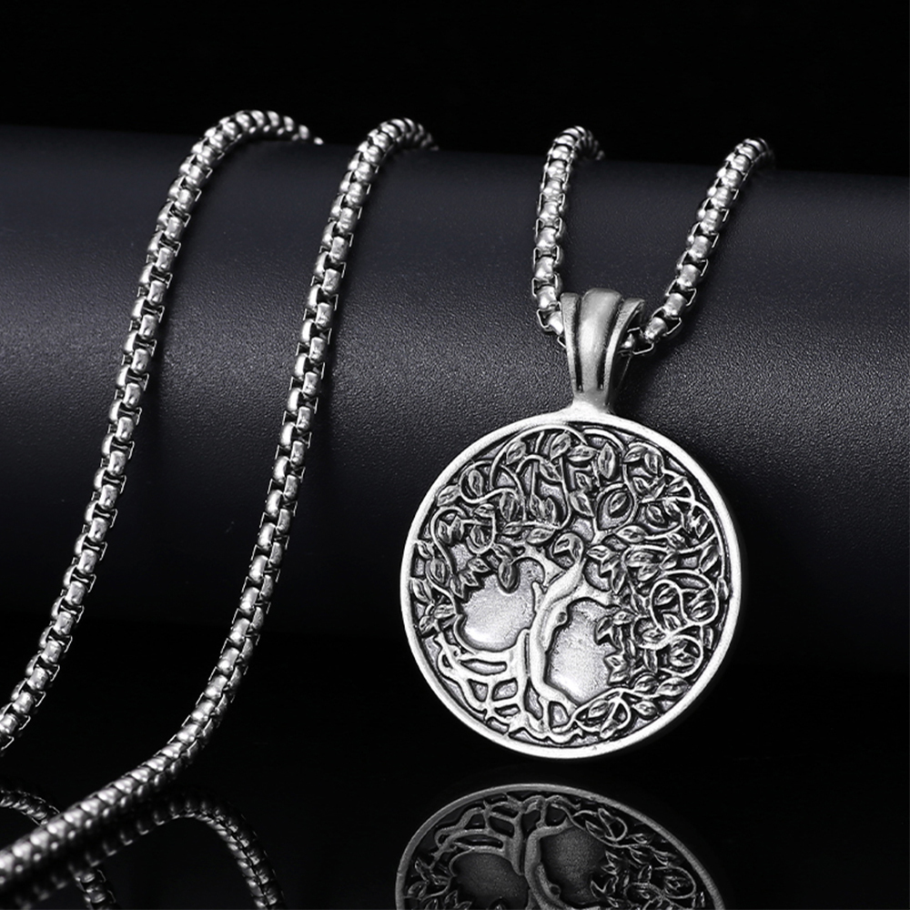Solid lead-free pewter pendant featuring a highly detailed 3D relief of a Tree of Life with lush leaves and deep roots on a solid circular background