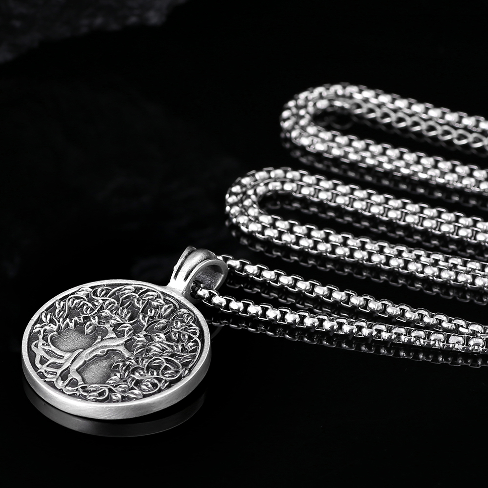 Solid lead-free pewter pendant featuring a highly detailed 3D relief of a Tree of Life with lush leaves and deep roots on a solid circular background