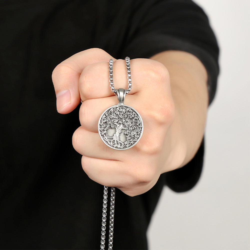 Solid lead-free pewter pendant featuring a highly detailed 3D relief of a Tree of Life with lush leaves and deep roots on a solid circular background