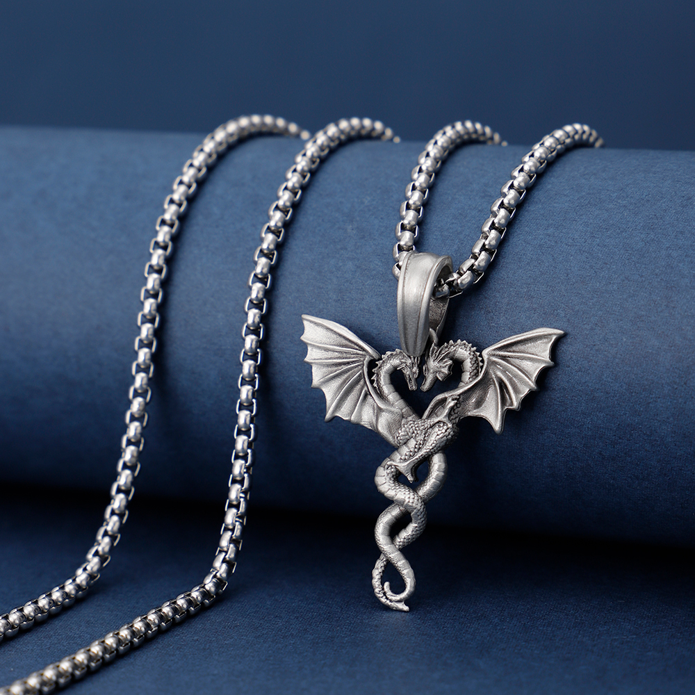 Solid lead-free pewter romantic pendant featuring two intertwined dragons facing each other to form a heart shape with their wings spread