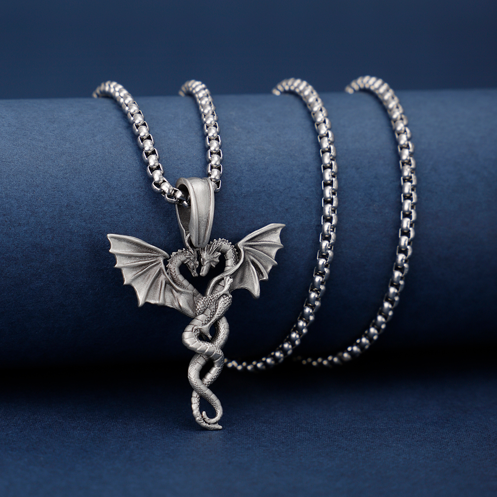 Solid lead-free pewter romantic pendant featuring two intertwined dragons facing each other to form a heart shape with their wings spread