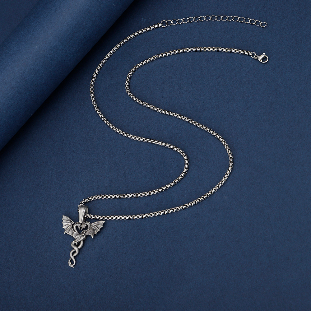 Solid lead-free pewter romantic pendant featuring two intertwined dragons facing each other to form a heart shape with their wings spread