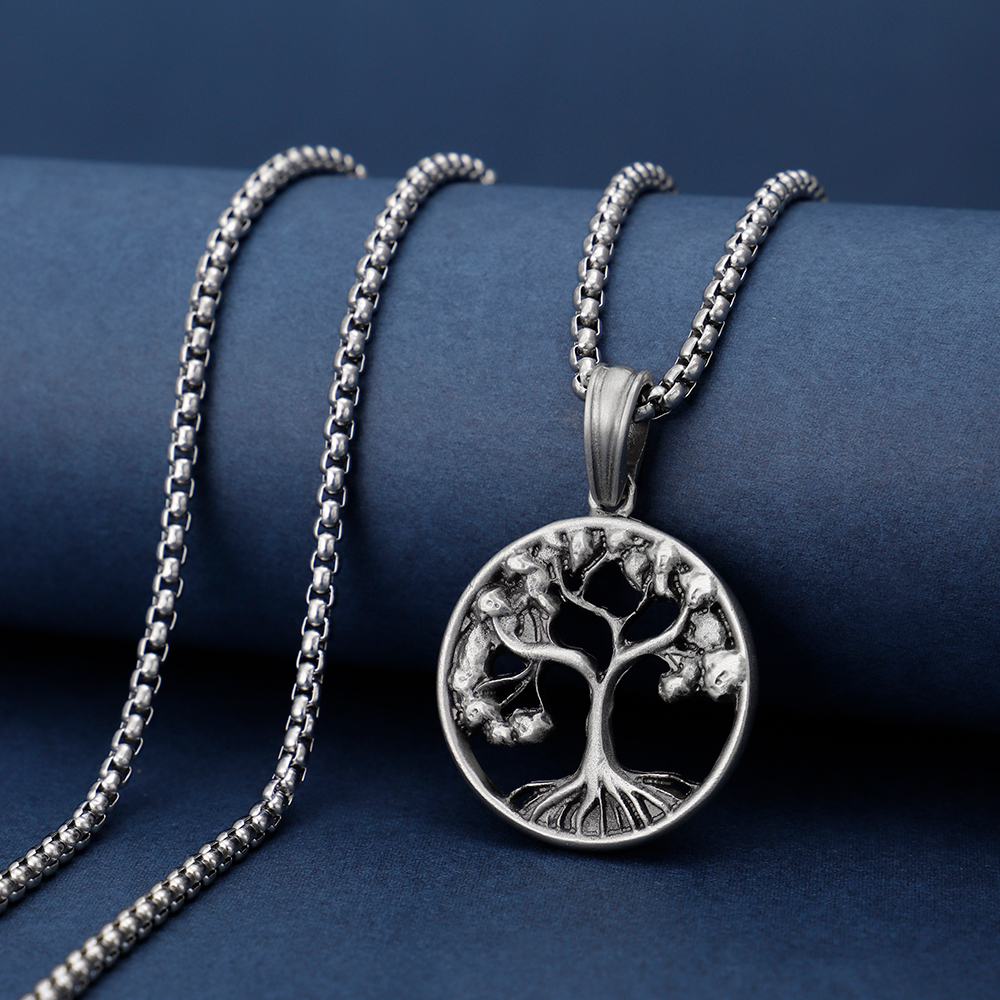 Solid lead-free pewter pendant featuring an intricate cutout Tree of Life design with branches and roots inside a circular frame