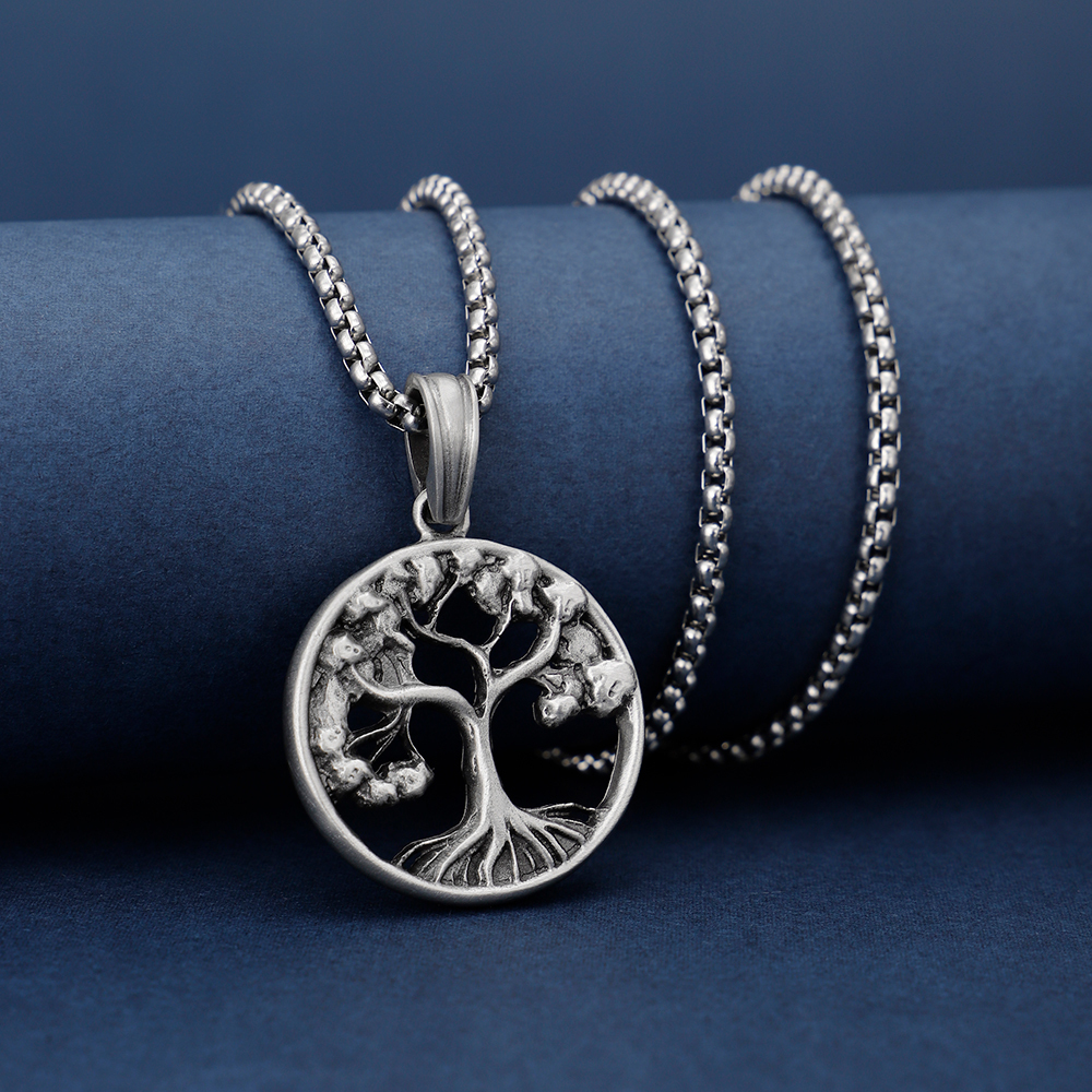 Solid lead-free pewter pendant featuring an intricate cutout Tree of Life design with branches and roots inside a circular frame