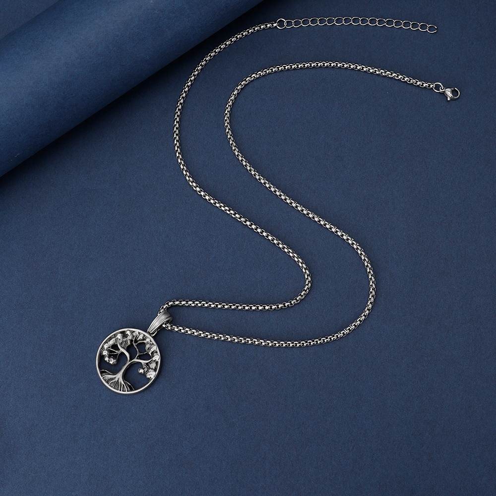 Solid lead-free pewter pendant featuring an intricate cutout Tree of Life design with branches and roots inside a circular frame