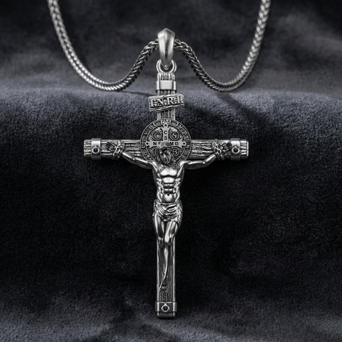 Solid lead-free pewter St. Benedict crucifix pendant featuring a detailed corpus, wood-grain cross texture, and the INRI plaque