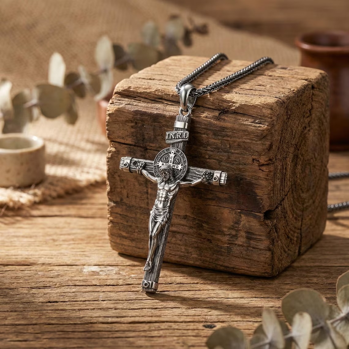 Solid lead-free pewter St. Benedict crucifix pendant featuring a detailed corpus, wood-grain cross texture, and the INRI plaque