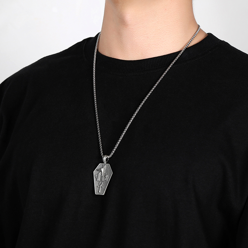 Solid pewter pendant shaped like an ancient Egyptian sarcophagus featuring a 3D relief of the jackal god Anubis and an Ankh symbol