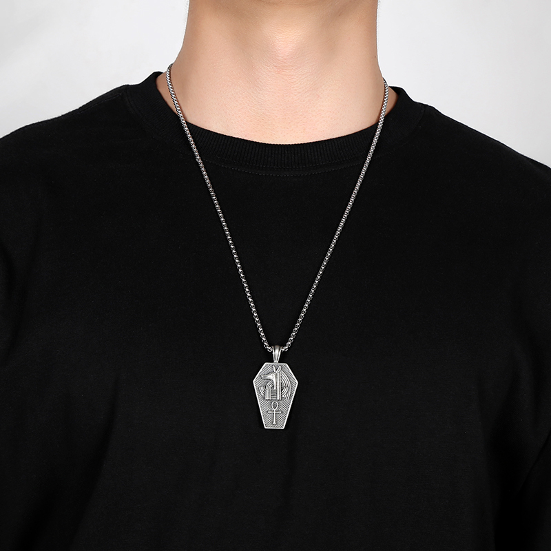 Solid pewter pendant shaped like an ancient Egyptian sarcophagus featuring a 3D relief of the jackal god Anubis and an Ankh symbol