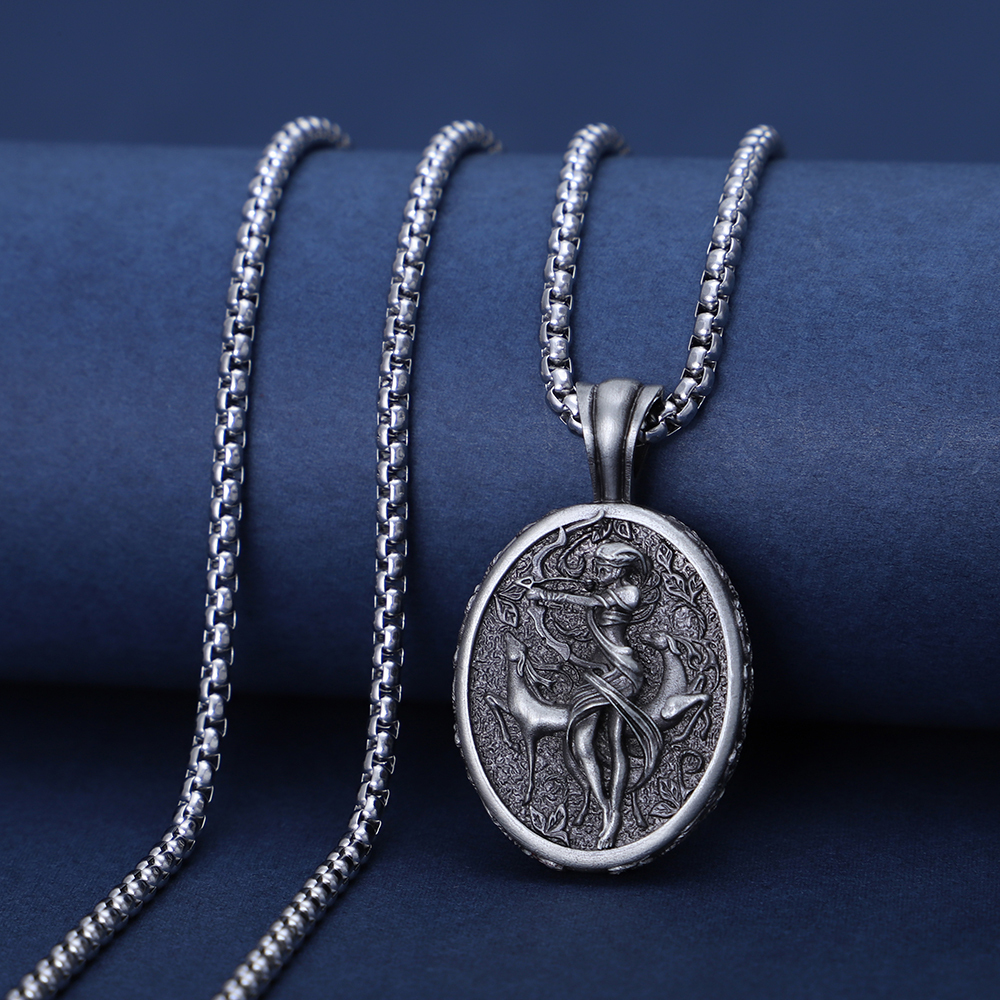 Solid lead-free pewter oval pendant featuring a detailed 3D relief of the Greek Goddess Artemis drawing a bow, accompanied by a sacred stag in a wild forest setting