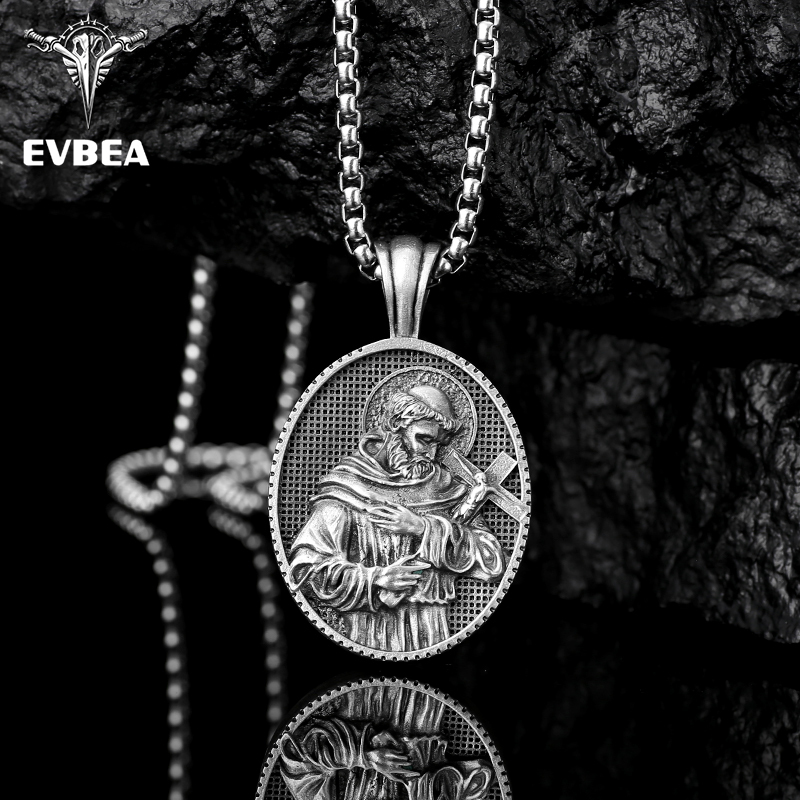 Solid lead-free pewter oval Catholic pendant featuring a 3D relief of Saint Francis of Assisi in a monk's habit holding a crucifix against a textured background