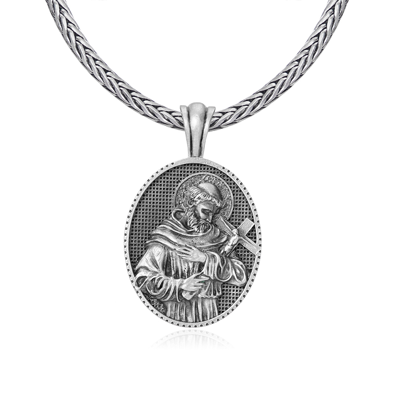 Solid lead-free pewter oval Catholic pendant featuring a 3D relief of Saint Francis of Assisi in a monk's habit holding a crucifix against a textured background