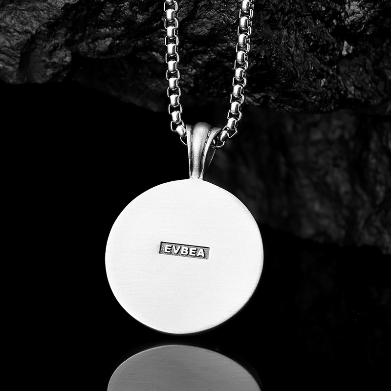 Solid lead-free pewter round medallion pendant featuring a highly detailed 3D relief of two wolves side-by-side against a textured stippled background