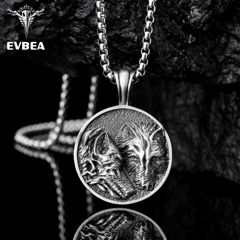 Solid lead-free pewter round medallion pendant featuring a highly detailed 3D relief of two wolves side-by-side against a textured stippled background