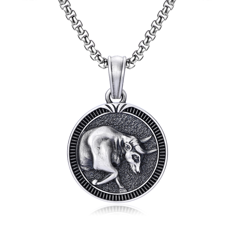 Solid lead-free pewter round medallion pendant featuring a 3D relief of a charging bull with a textured background and a grooved coin-like border