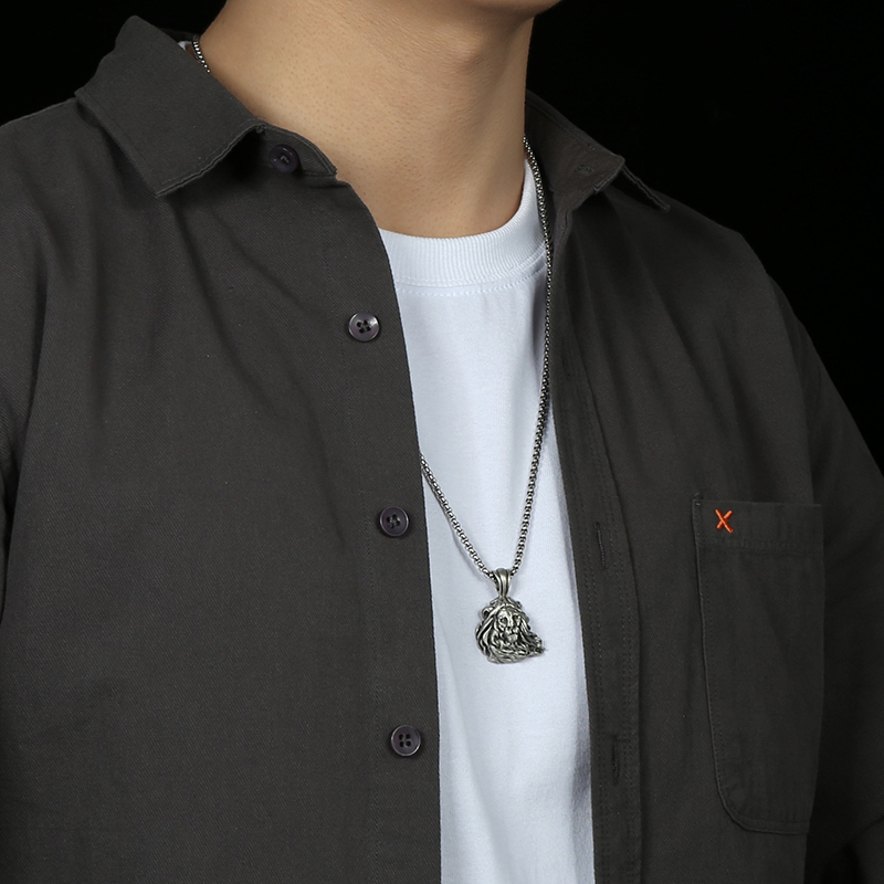 Model wearing EVBEA solid pewter lion head pendant necklace in vintage matte finish
