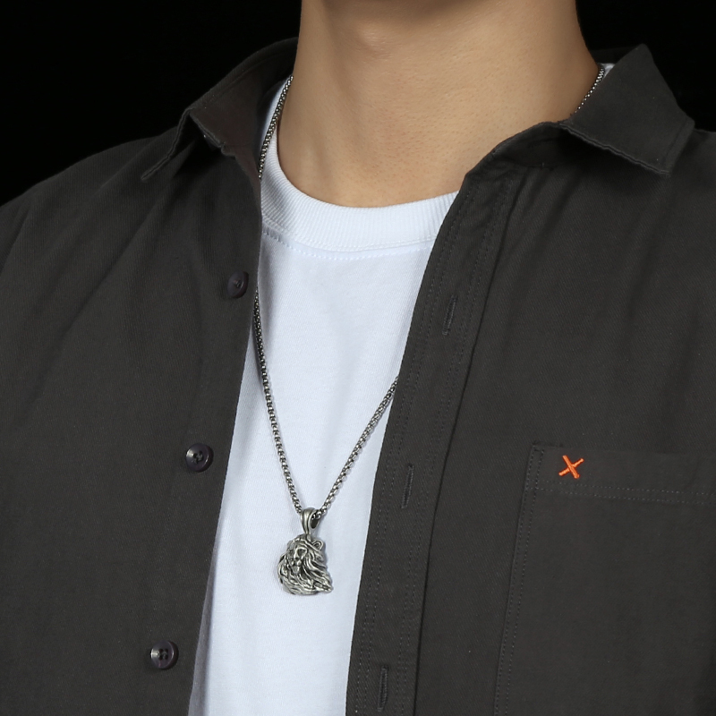 Model wearing EVBEA solid pewter lion head pendant necklace in vintage matte finish