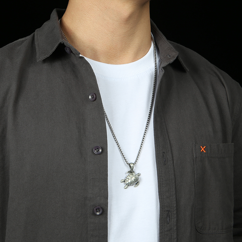 Model wearing EVBEA solid pewter sea turtle ocean totem pendant necklace