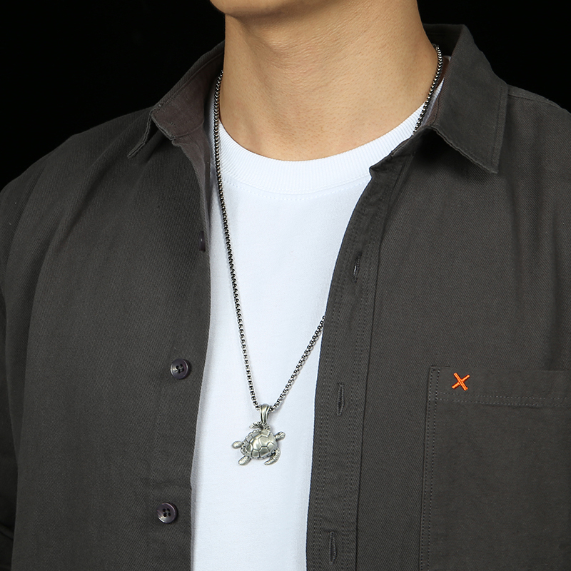 Model wearing EVBEA solid pewter sea turtle ocean totem pendant necklace