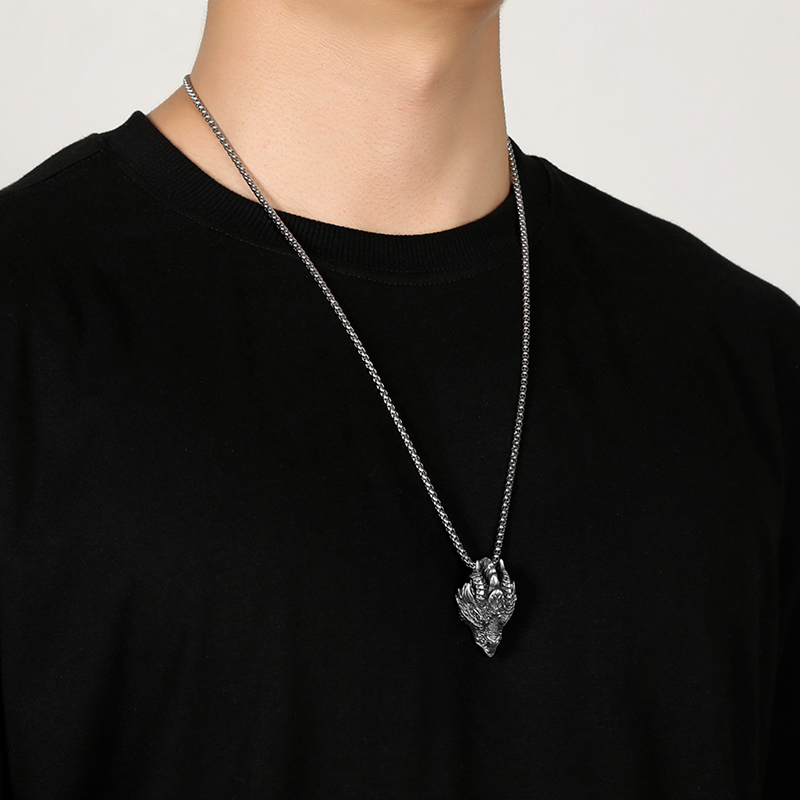 Model wearing EVBEA solid pewter mythical dragon head pendant necklace for men