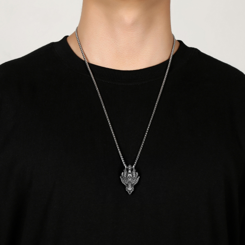 Model wearing EVBEA solid pewter mythical dragon head pendant necklace for men