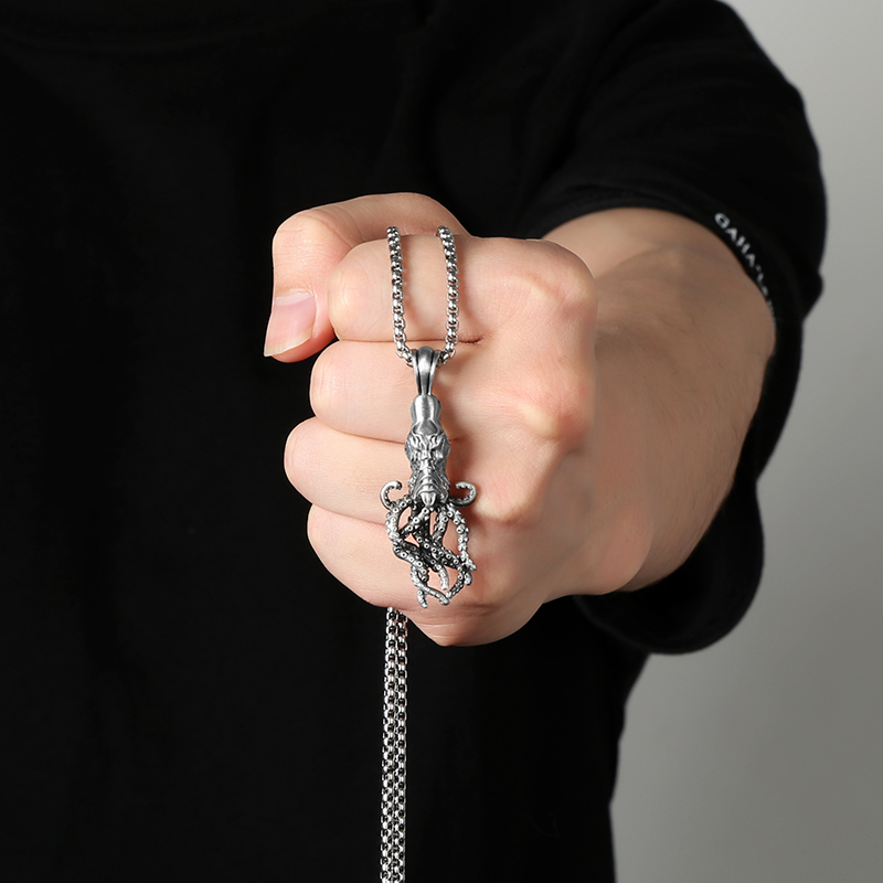 Close-up of hand-brushed solid pewter octopus tentacles and suction cups with EVBEA stamp