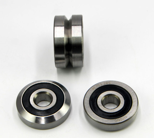 RE703 - Łożyska przegubowe, rolki gąsienicowe z jednym profilem ukosującym