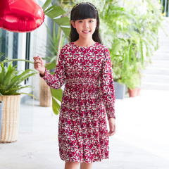 Current children's dress has a red base with floral patterns, a waist - cinching design, long sleeves, retro prints, and is artistic, literary and cute.