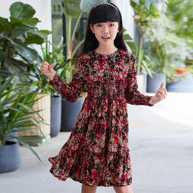 New children's dress with a red base and floral patterns, featuring a waist - cinching design and long sleeves, and retro prints.