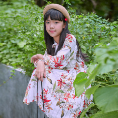 New Girls' Floral Dress, with a white base, blooming flowers and a bow neckline, showcasing a fresh and sweet style.