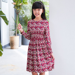 Current children's dress has a red base with floral patterns, a waist - cinching design, long sleeves, retro prints, and is artistic, literary and cute.