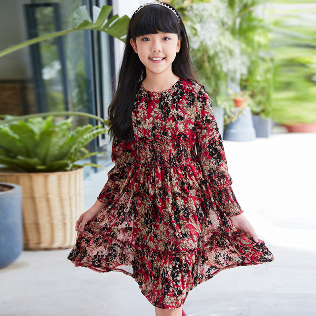 New children's dress with a red base and floral patterns, featuring a waist - cinching design and long sleeves, and retro prints.