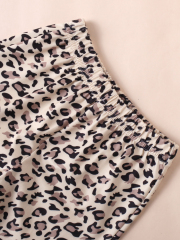 Children's Christmas - themed red top with leopard - print flared pants set