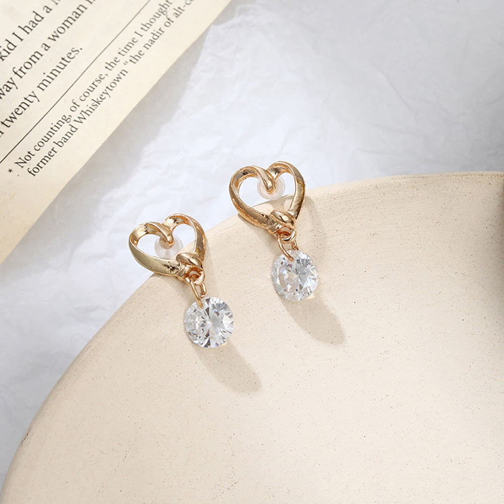 Elegant hollow heart zircon stud earrings for girls